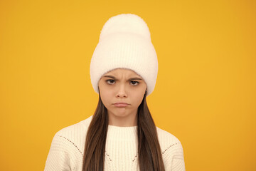 Angry teen girl. Child looking at camera with hate and rage negative facial expression. Unhappy sad...