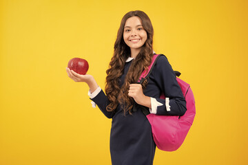Back to school. Teenager school girl with backpack hold aplle ready to learn. School children with...