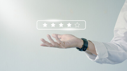 Close up of open hand with  five star rating feedback and review. for giving best score point to...