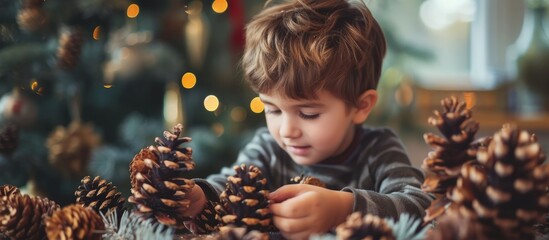 Child crafting pine cones into holiday decorations