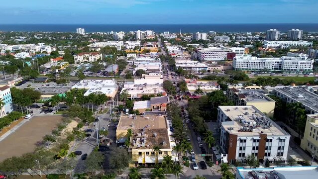 A panning drone shot of downtown Delray Beach Florida along Atlantic Avenue.