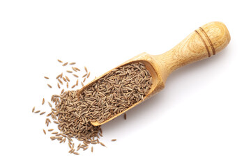Top view of Organic Cumin Seeds (Cuminum cyminum) or jeera in a wooden scoop. Isolated on a white...