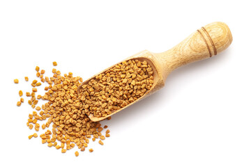 Top view of Organic Fenugreek seeds (Trigonella foenum-graecum ) in a wooden scoop. Isolated on a white background.