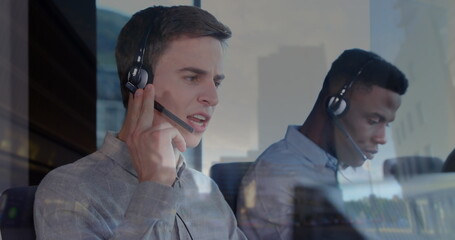 Image of diverse business people in office over cityscape