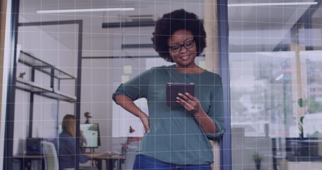Fototapeta premium Image of data processing over african american businesswoman in office