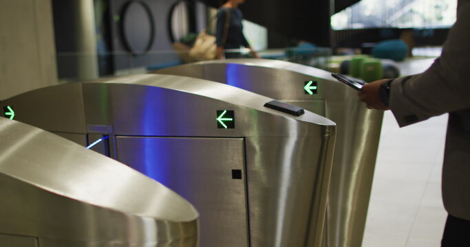 African American businessman at office turnstiles, with copy space