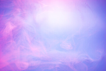 Pink and purple smoke on light blue background. Soft smoke texture