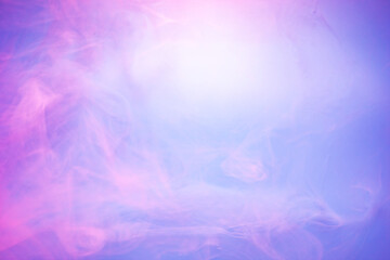 Pink and purple smoke on light blue background. Soft smoke texture