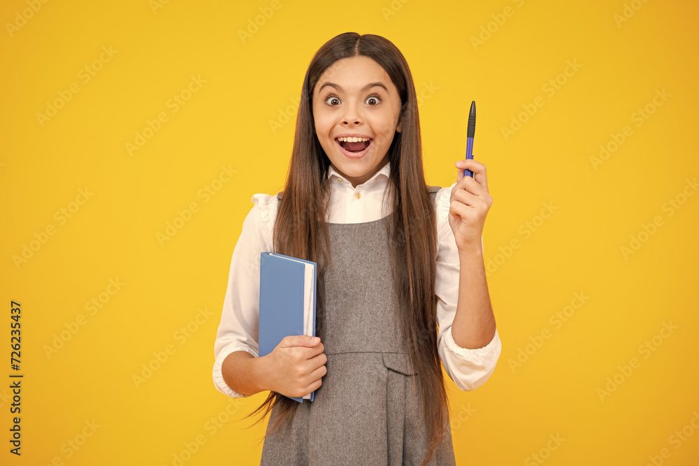 Canvas Prints excited face. teen girl pupil hold books, notebooks, isolated on yellow background, copy space. back