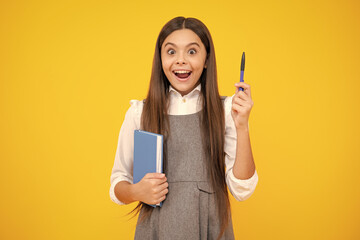 Excited face. Teen girl pupil hold books, notebooks, isolated on yellow background, copy space. Back to school, teenage lifestyle, education and knowledge. Amazed expression, cheerful and glad.