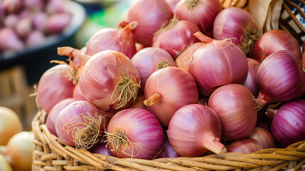 Bunch of fresh red onions in a wicker basket.