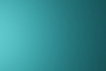 Fototapeta premium Paper texture, abstract background. The name of the color is macaw blue green