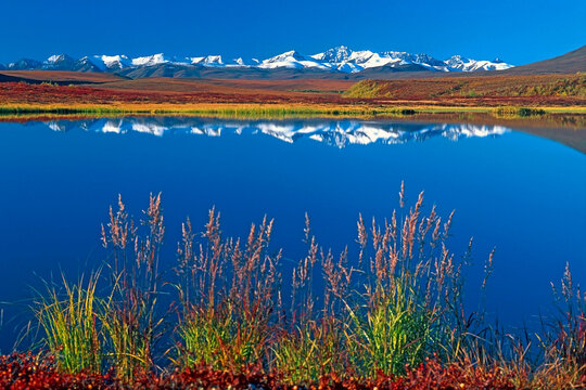 Beautiful fall Landscape with Mountains reflecting in water, Dempster Highway, Yukon Canada,