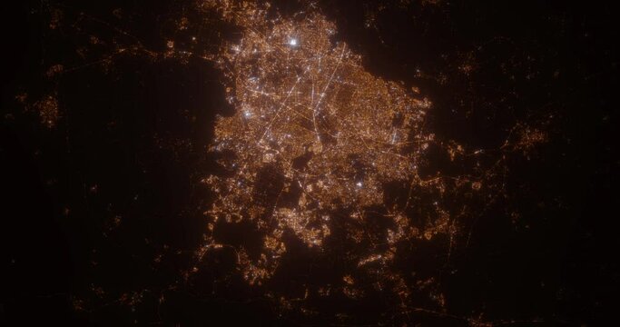 Guadalajara (Mexico) aerial view at night. Satellite view on modern city with street lights. Camera is flying above the city, moving forward