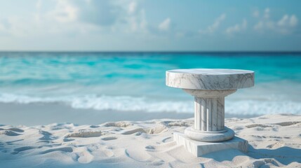 Marble pedestal on beach sand, tropical sea softly blurred