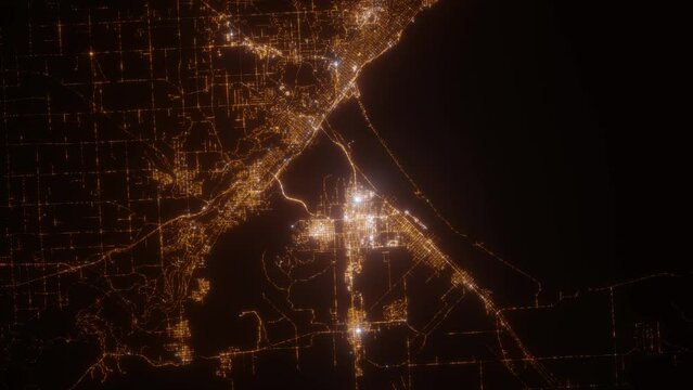 Duluth (Minnesota, USA) aerial view at night. View on modern city from space. Camera is zooming in, rotating counterclockwise