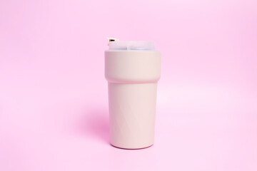 Travel Coffee Beige Mug on Pink Background, Thermo Hot Coffee Tumbler, Reusable Tea Mug with Seal...