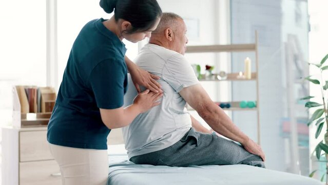 Physical therapy, back massage and physiotherapist with senior man in medical office at clinic. Rehabilitation, patient and healthcare worker helping elderly male person healing muscle pain of injury