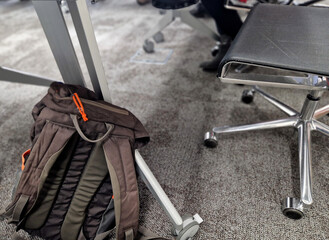  forgotten backpack in the office. gray carpet. stainless steel stinger in the meeting room with...