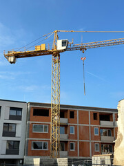 Tower crane at the construction of a new apartment building