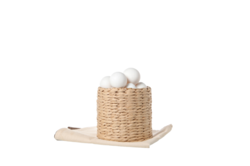 PNG, eggs in a round basket, isolated on white background.