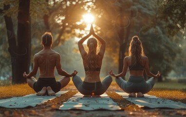 Two indian male and female person do yoga mediation exercise together in the summer park outdoor. - obrazy, fototapety, plakaty