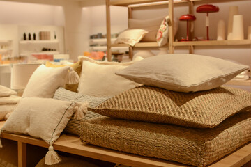 Stack of stylish decorative pillows in a store. a piece of interior