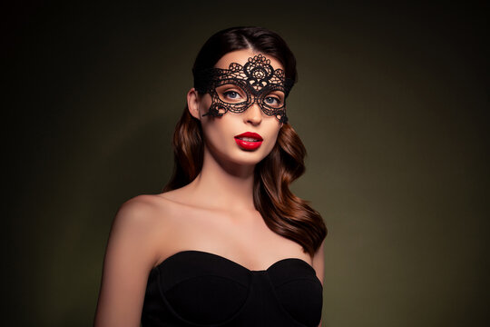 Photo of stunning glamour young lady on gothic halloween masquerade wear couture face mask on khaki color background
