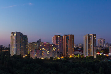 Apartment buildings in one of the districts of the city during the evening hours