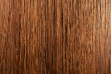Close up of brown hair as background. Texture of natural hair..