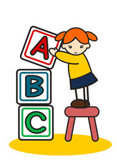 アルファベットのブロックを積む女の子