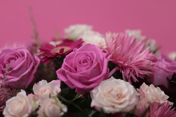 Bunch of flowers. Beautiful bouquet of fresh pink roses in full bloom on pink background, close up. Top view.  Valentine day or Mother day, love concept. Stock photo