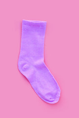 Pink sock on  pink  background.