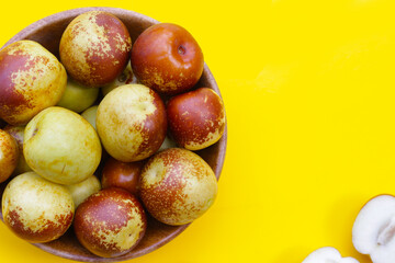Fresh jujube fruit on yellow background