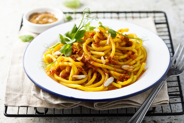 Pasta with red pesto and almond