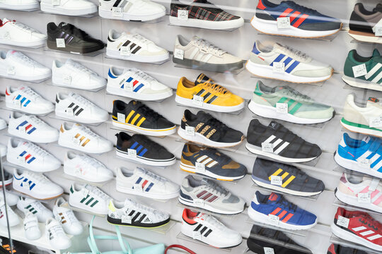 Tarragona, Spain - February 02, 2023: Showcase with sneakers of different brands.