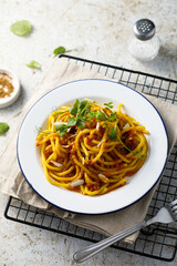 Pasta with red pesto and almond