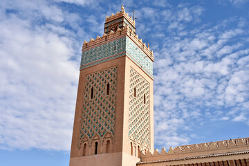 Fototapeta na wymiar Saadian Tombs Minaret with Scattered Clouds, Marrakech, Morocco
