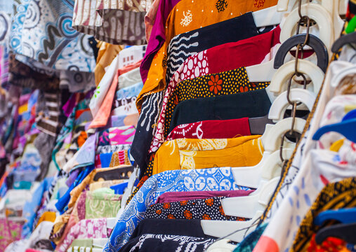 Traders sell various batik clothes with various motifs at Beringharjo Market, Jogjakarta, Indonesia. Batik is a traditional Indonesian cloth motif recognized by UNESCO.