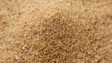 Sprinkle breadcrumbs on heap, close up