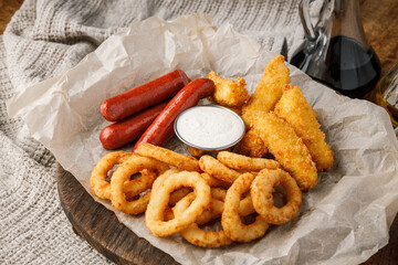 Fried squid rings and sausages with mayonnaise sauce