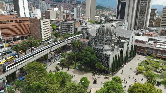 Establishing Aerial of Downtown Medellin City Buildings and Trains