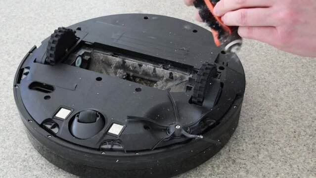 Cleaning automatic vacuum cleaner, tangled hair on a roller