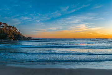 Fototapeta premium Sunrise at the seaside with high clouds