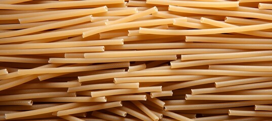 Close up top view of traditional italian pennettine pasta as abstract background