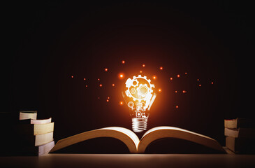Creative thinking process. Light bulb with gear icon floating on book. Meaning of excellent ideas,...