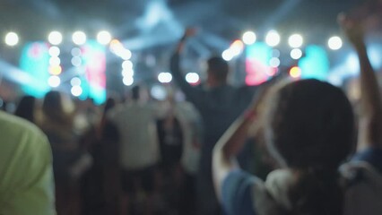 Unrecognizable People Crowd Dance and Hands Up at Evening Live Music Concert on Stage at Festival with Laser and Light in Slow Motion