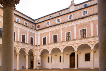 Internal courtyard of the ducal palace of Urbino, in the Marche region, Italy. The square is empty...