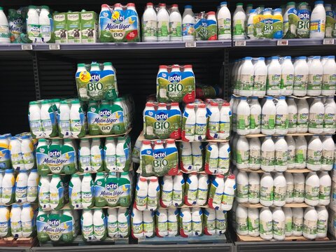 FRANCE, BORDEAUX, February, 2, 2024: Shelves with different dairy products from various manufacturers in supermarket. High quality photo