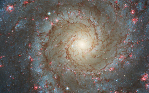 Face-on spiral galaxy, NGC 628. Bright galactic long-range captured imagery. Elements of this image furnished by NASA (observed by the Hubble telescope)